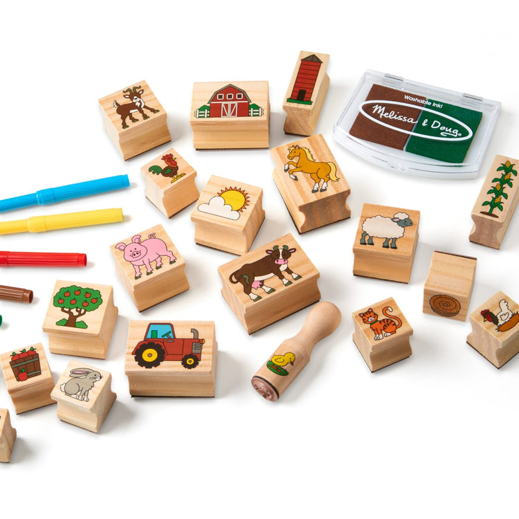 The loose pieces of the Melissa & Doug Stamp-a-Scene Wooden Stamp Set: Farm - 20 Stamps, 5 Colored Pencils, and 2-Color Stamp Pad
